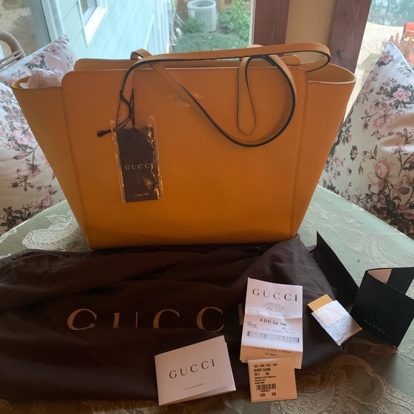 Handbags - Gucci swing tote